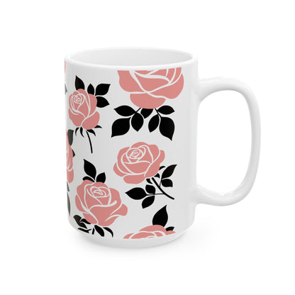 White mug with pink and black floral pattern on a white background