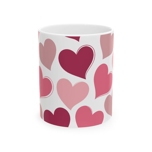 White mug with pink heart pattern on a white background
