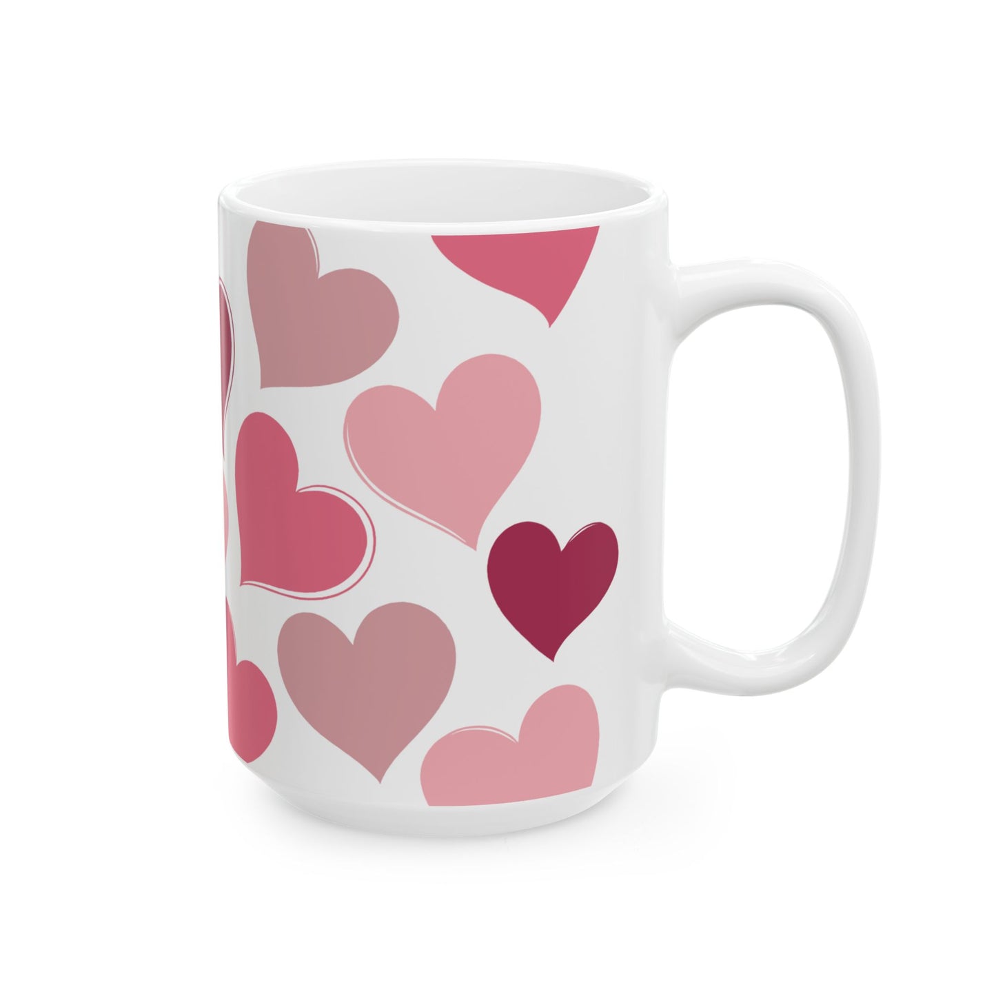 White mug with pink heart pattern on a white background