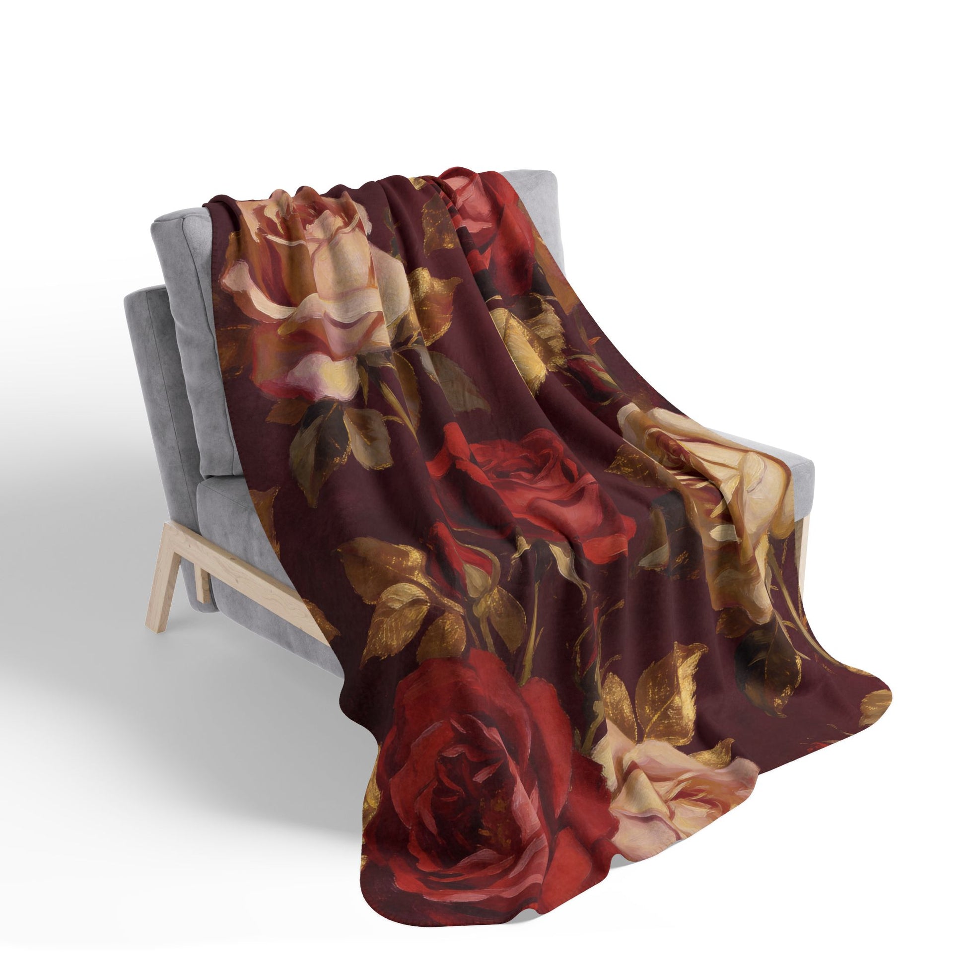 Floral rose patterned blanket draped over a chair.