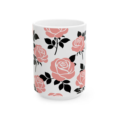 White mug with pink and black floral pattern on a white background