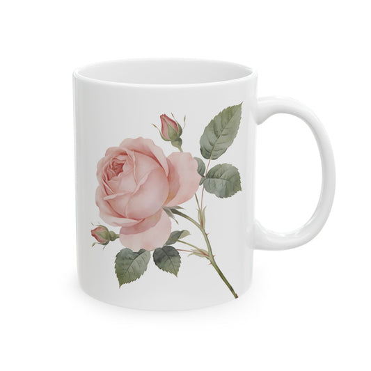 White mug with a pink rose design on a white background