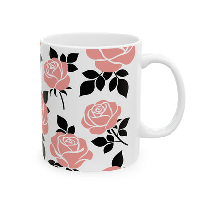 White mug with pink and black floral pattern on a white background