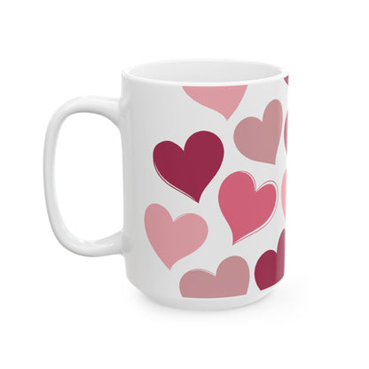 White mug with pink heart patterns on a white background